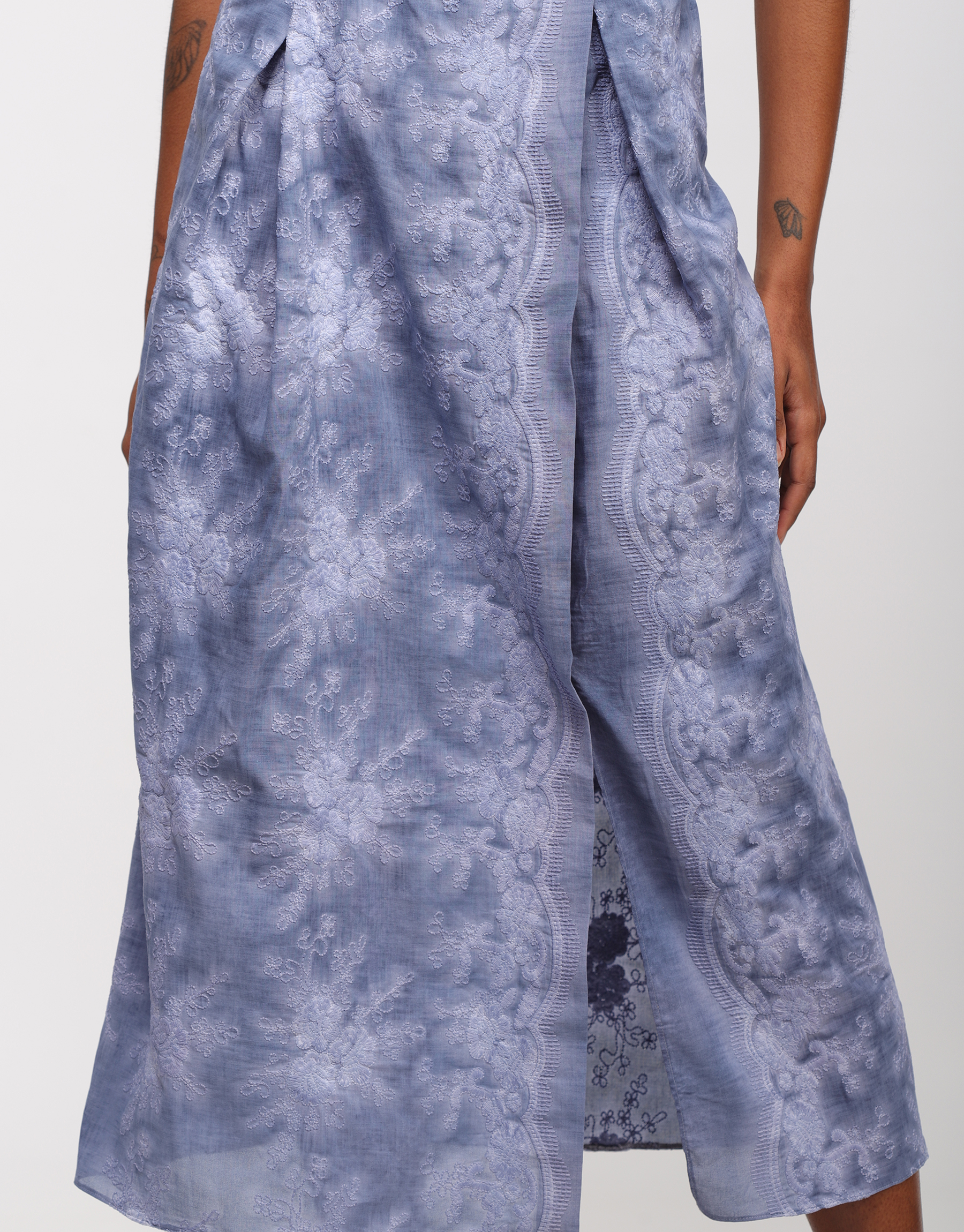 Long pleated skirt in embroidered faded denim blue cotton canvas