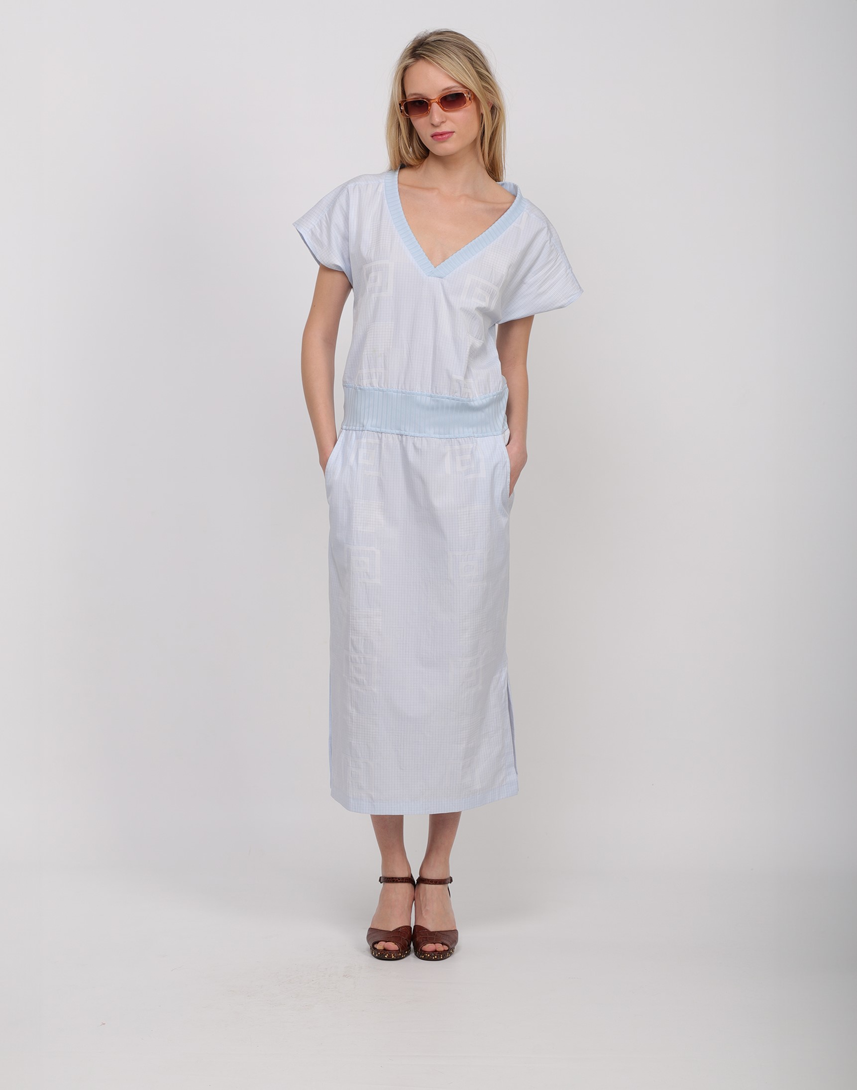 Flowing shift dress in light blue cotton with geometric patterns