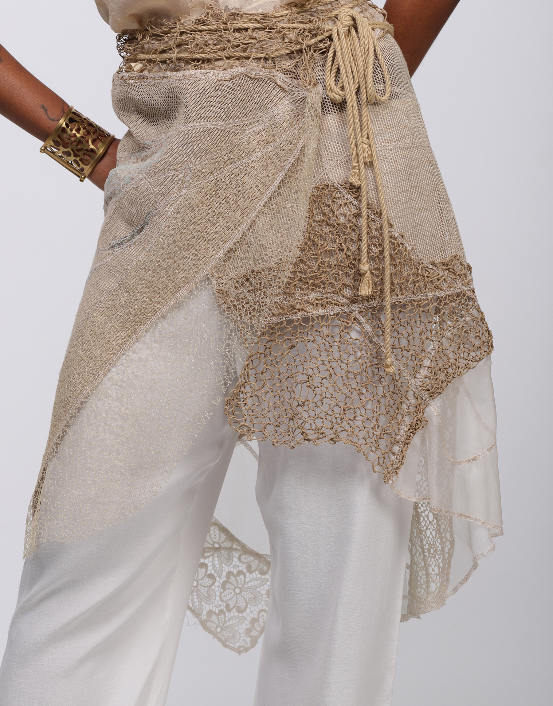 Wrap skirt in beige, ivory embroidered patchwork mesh and knitted string