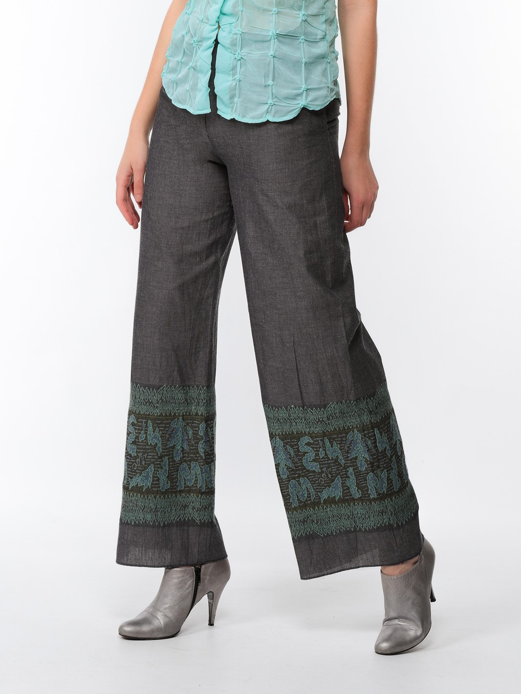 Wide trousers in steel grey canvas with turquoise and khaki embroidered stockings