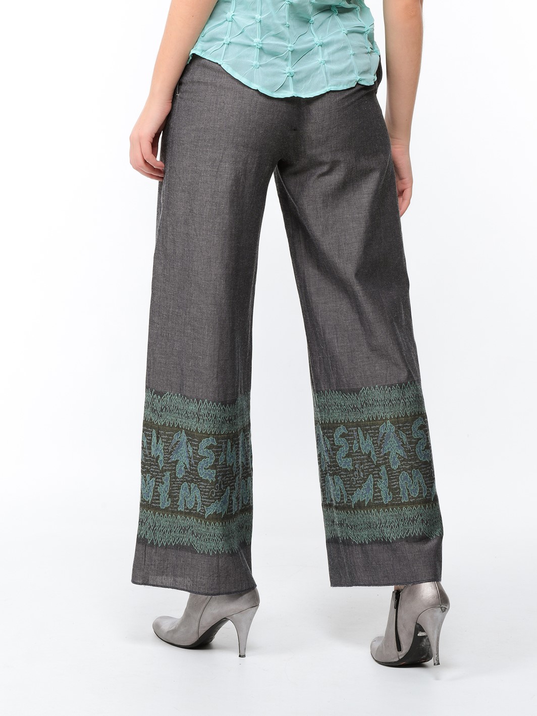 Wide trousers in steel grey canvas with turquoise and khaki embroidered stockings